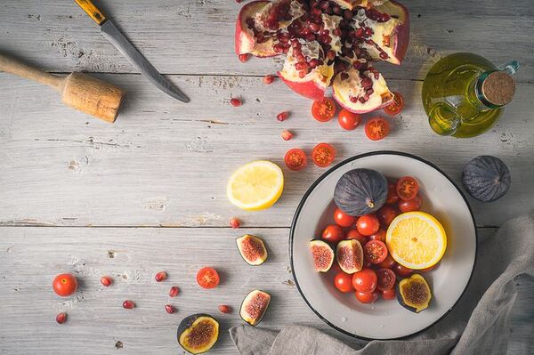 A colorful bowl with fresh ingredients on a wooden table